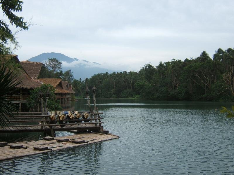 Lake with bamboo dock and huts