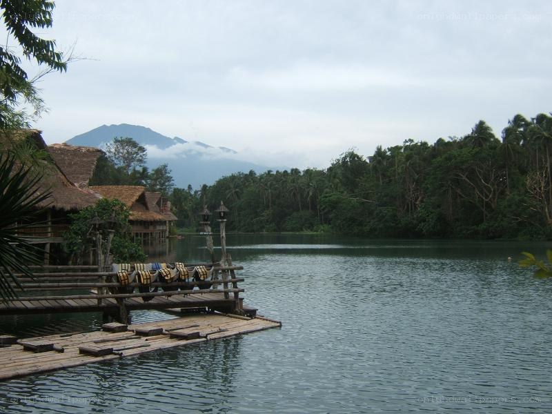 Lake with bamboo dock and huts