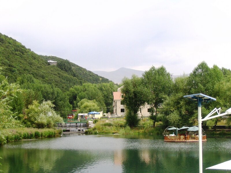 Lake with boat and hillside