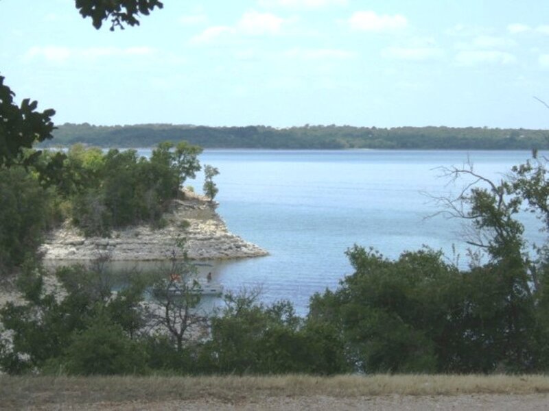 Lake with boat and rocky shore