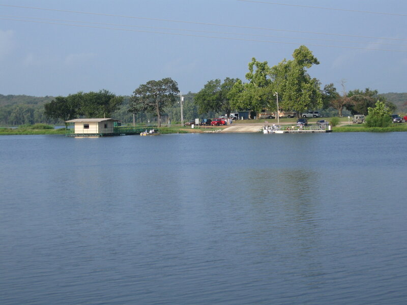 Lake with boat dock and cabin