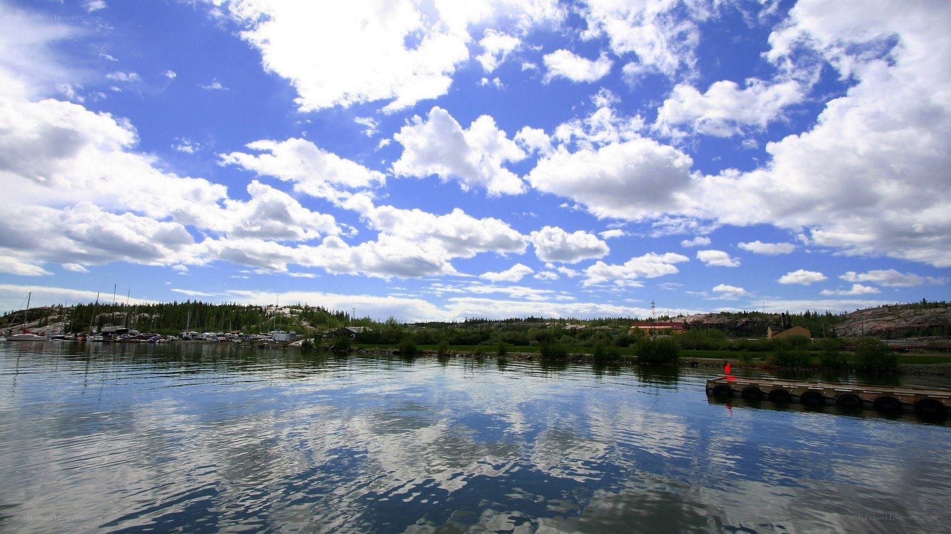 Lake with boats and dock