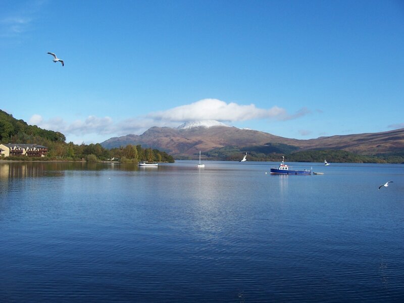Lake with Boats and Mountain