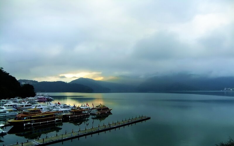 Lake with boats at dawn