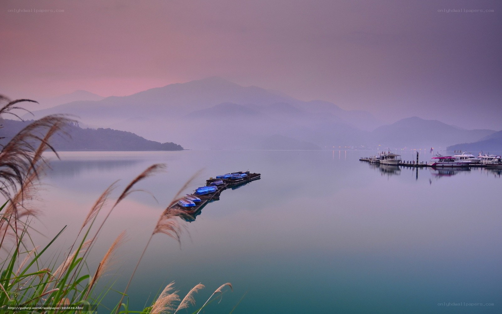 Lake with boats at dawn