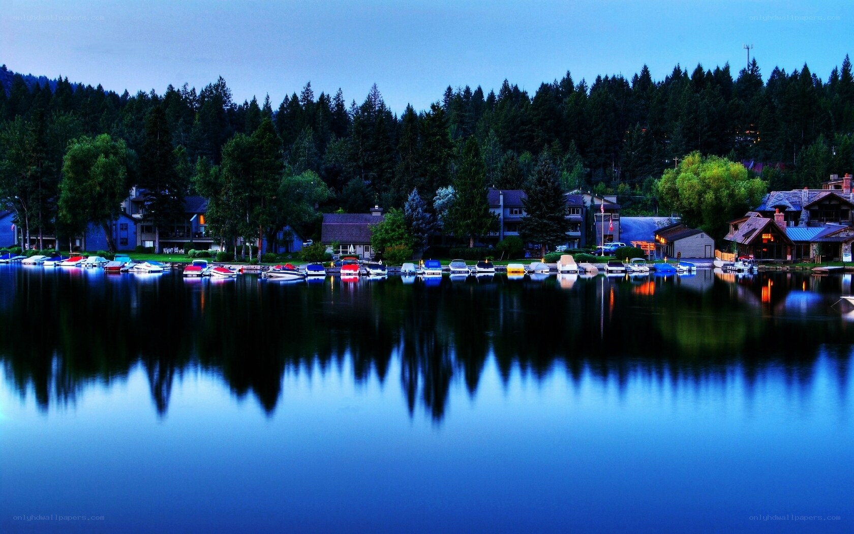 Lake with boats at dusk