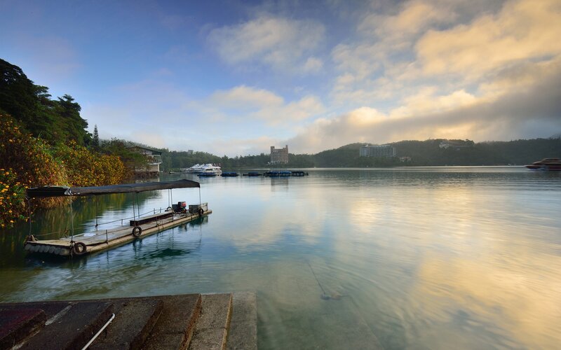 Lake with boats at sunrise
