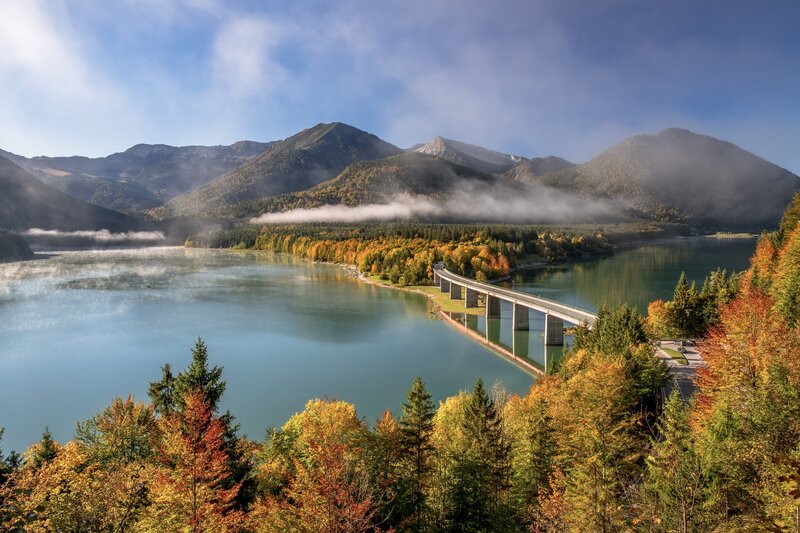 Lake with Bridge and Mountains