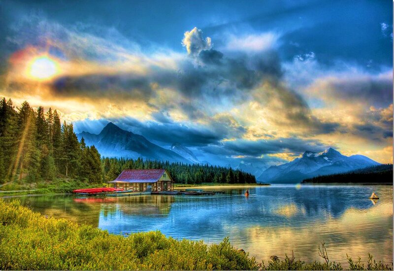 Lake with Cabin and Mountains