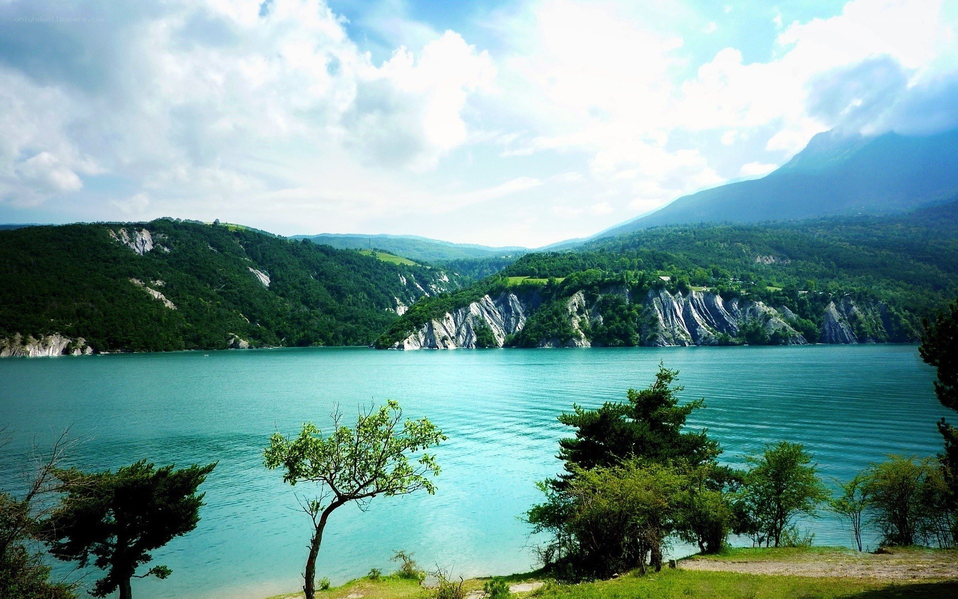 Lake with cliffs and mountains