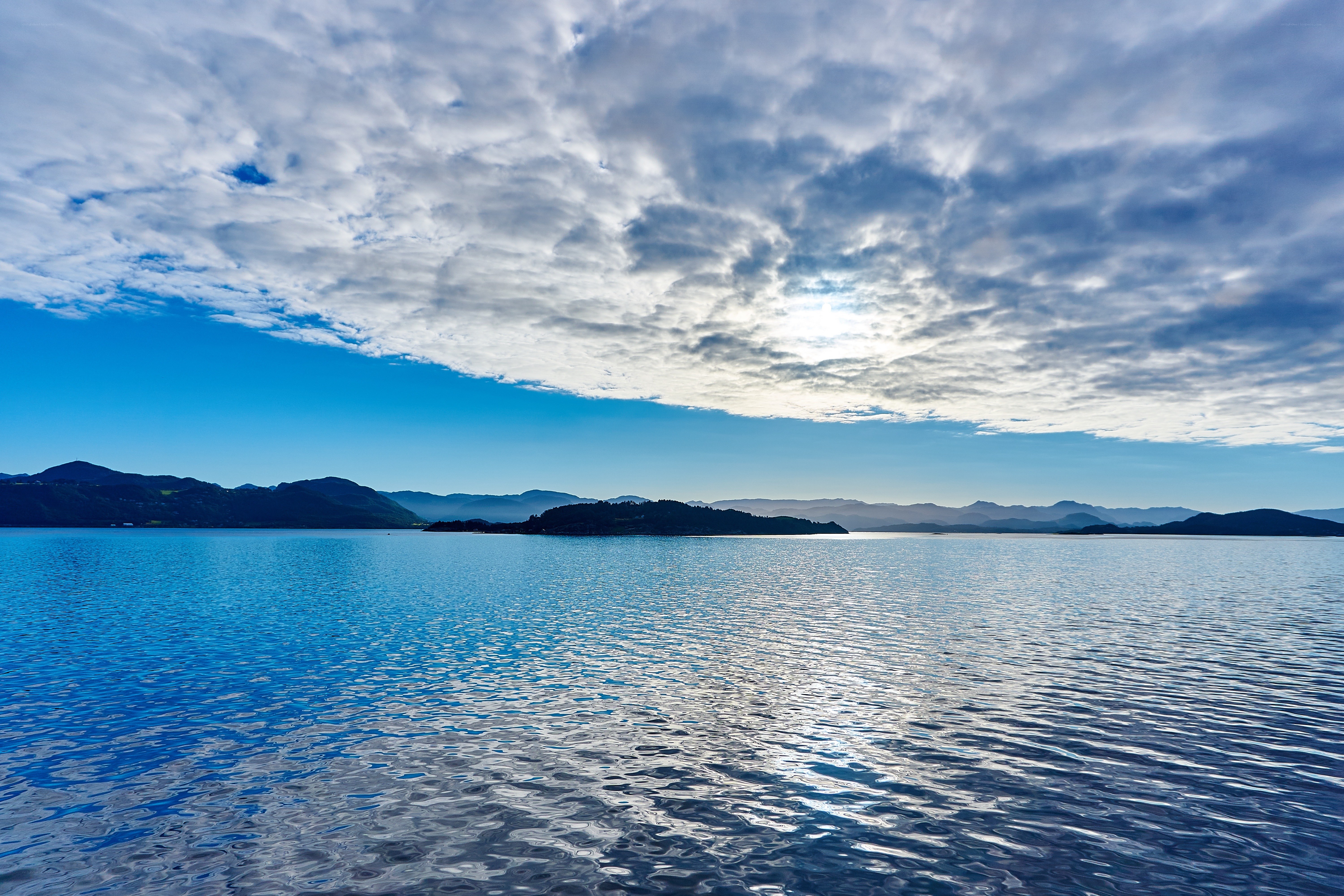 Lake with cloudy sky