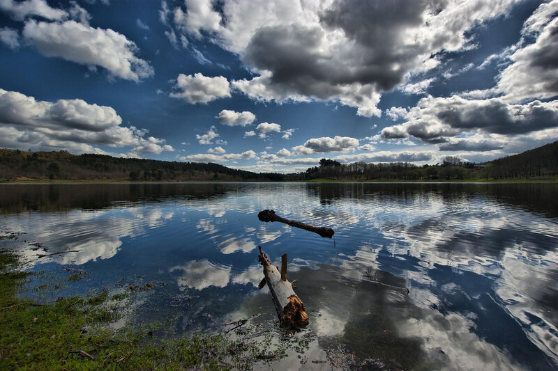 Lake with cloudy sky reflection