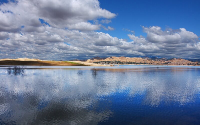 Lake with cloudy sky reflection