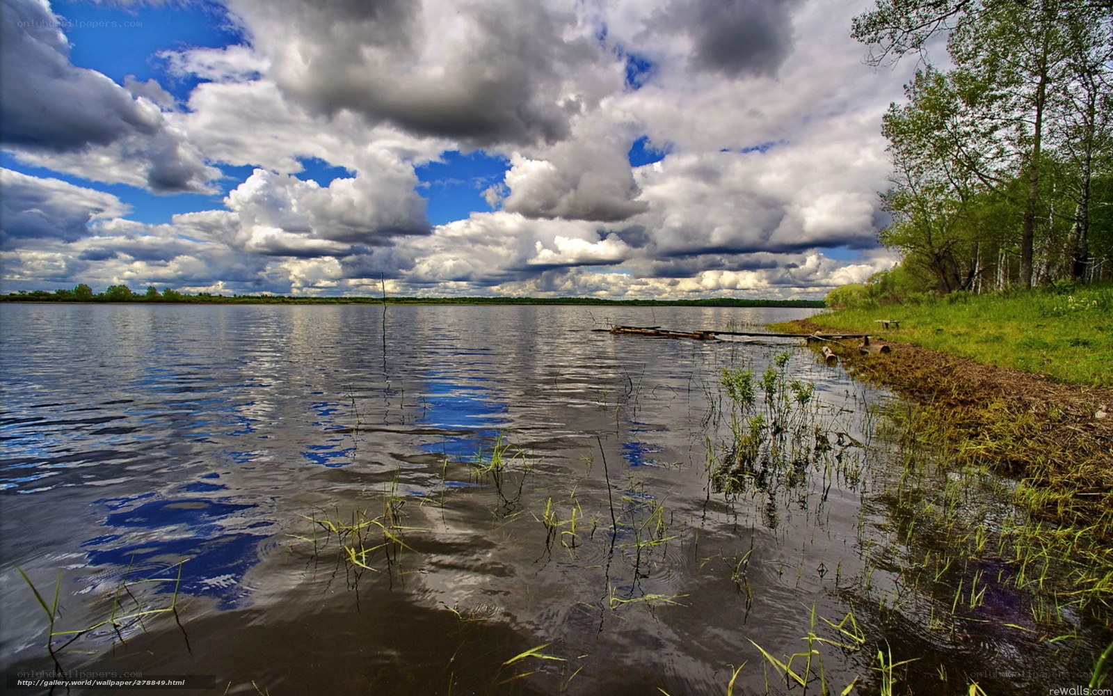 Lake with cloudy sky
