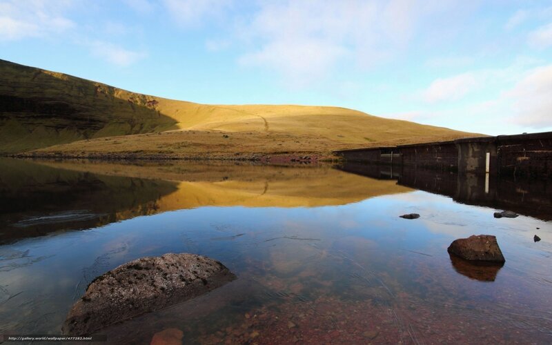 Lake with dam and hills