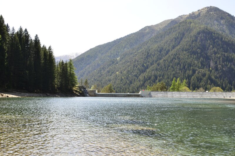 Lake with dam in mountain valley