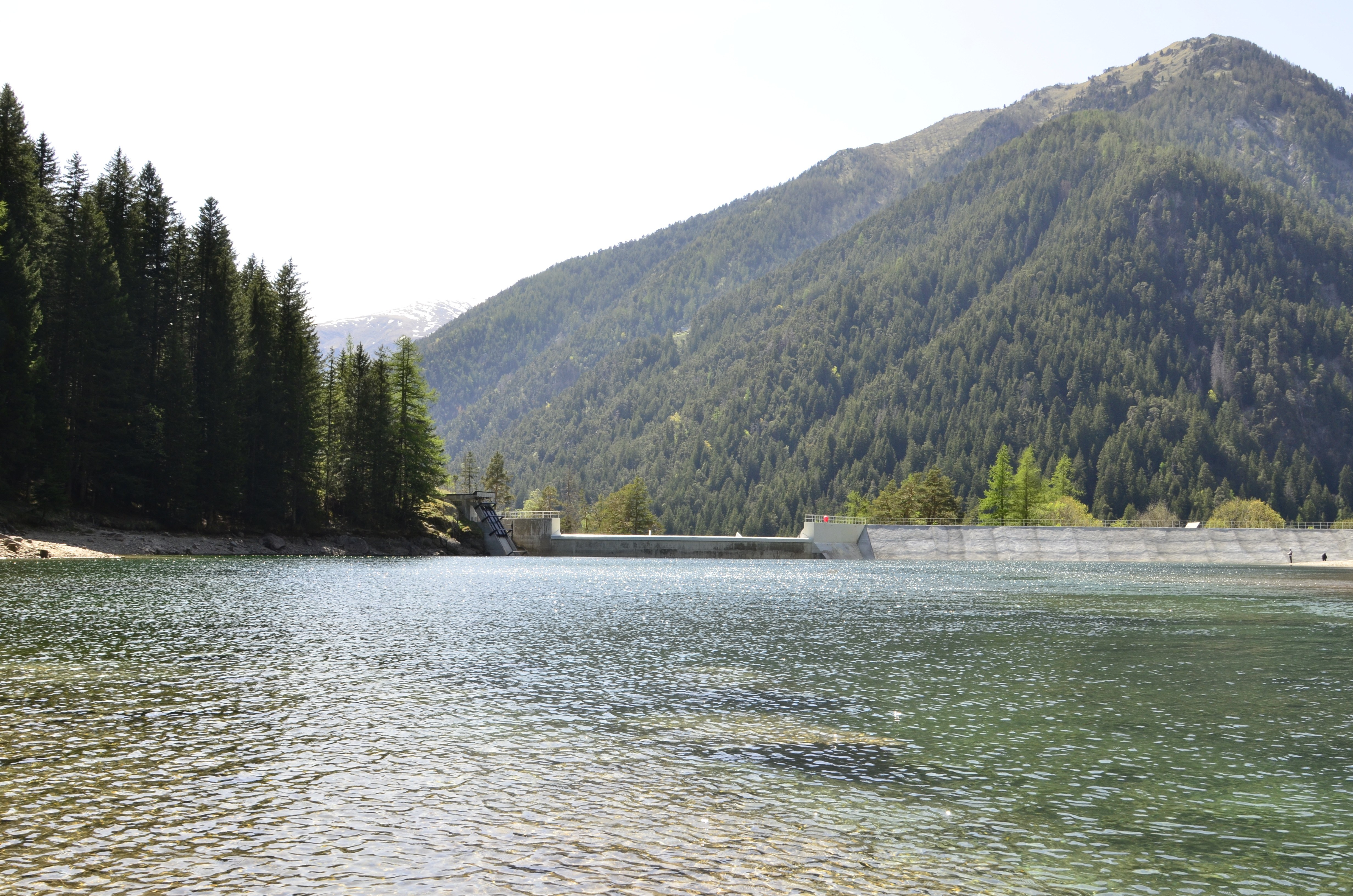 Lake with dam in mountain valley