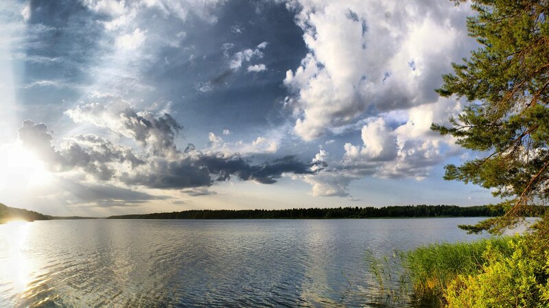 Lake with dramatic clouds at sunset