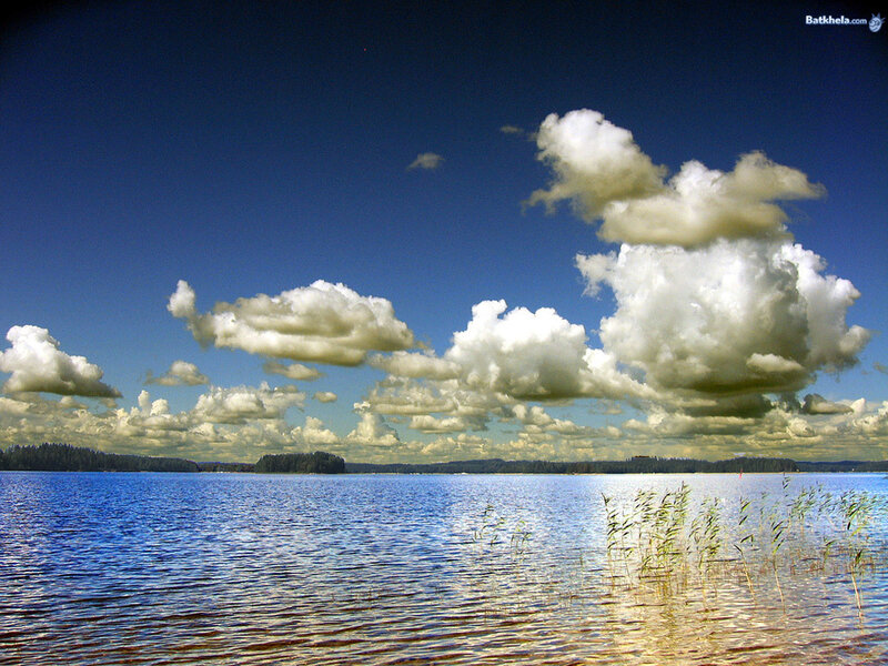 Lake with fluffy clouds