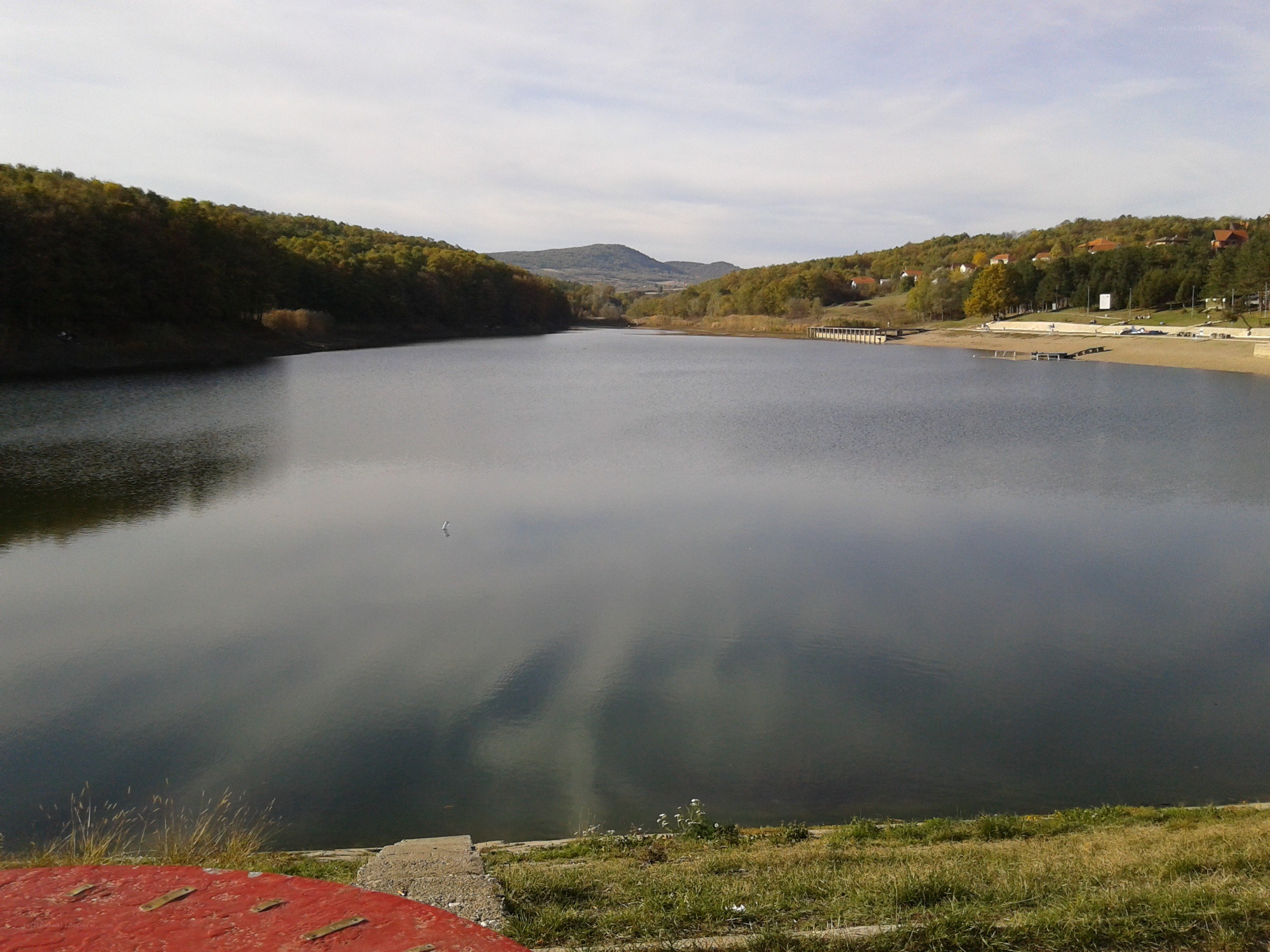 Lake with forested hills