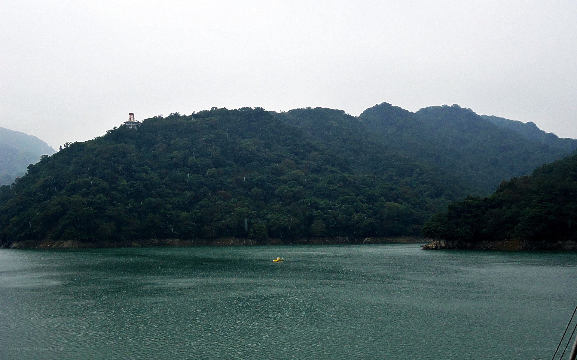 lake with forested hills