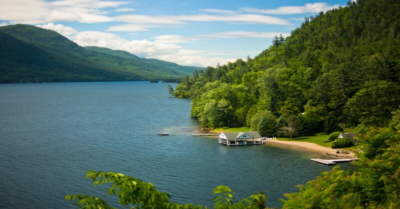 Lake with Forested Shore — Blue, Serene, Afternoon, Photograph, Mountain