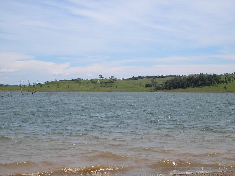 Lake with green hills in background