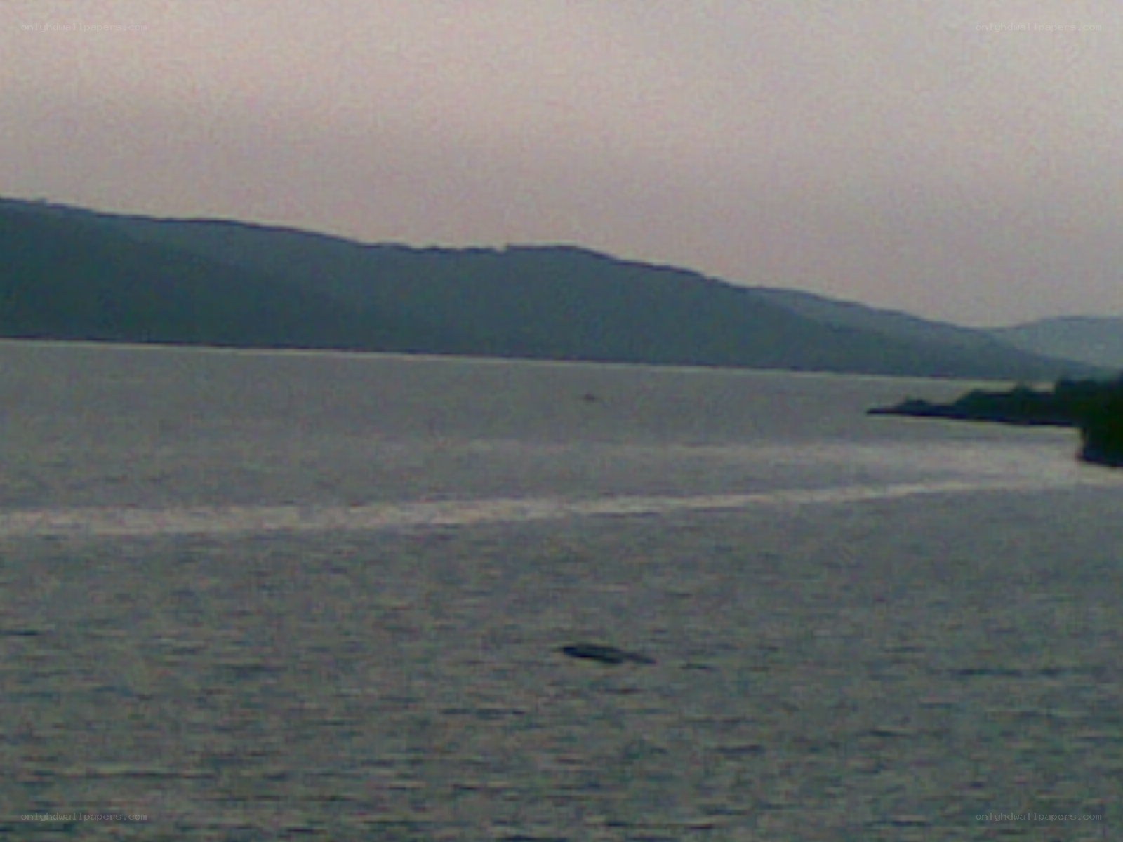 Lake with hills in background