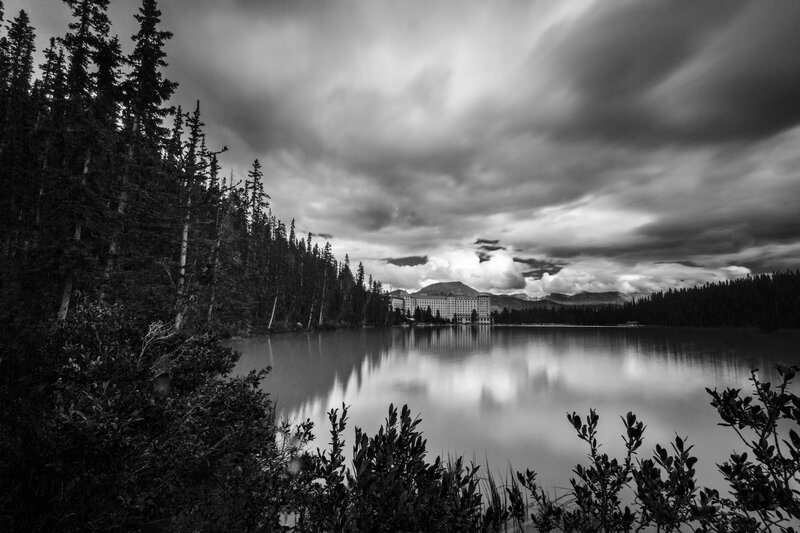 Lake with Hotel and Mountains