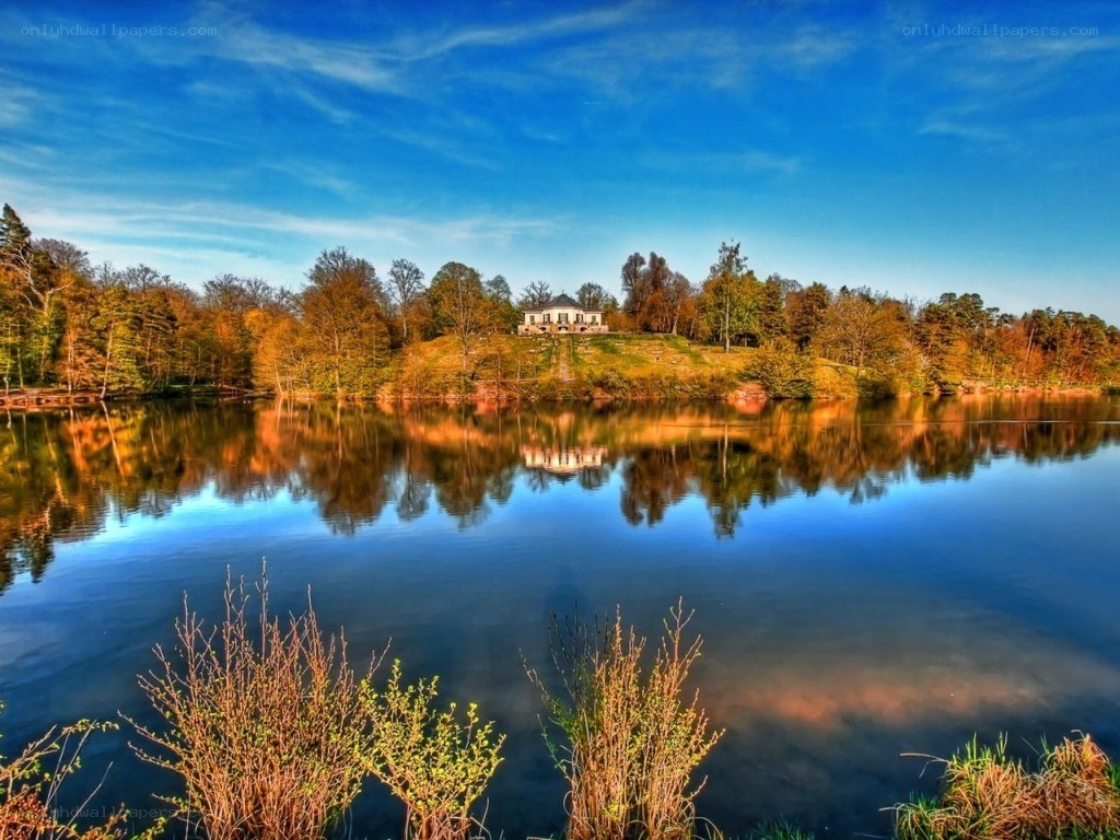 Lake with house on hill