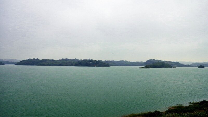 Lake with islands under overcast sky