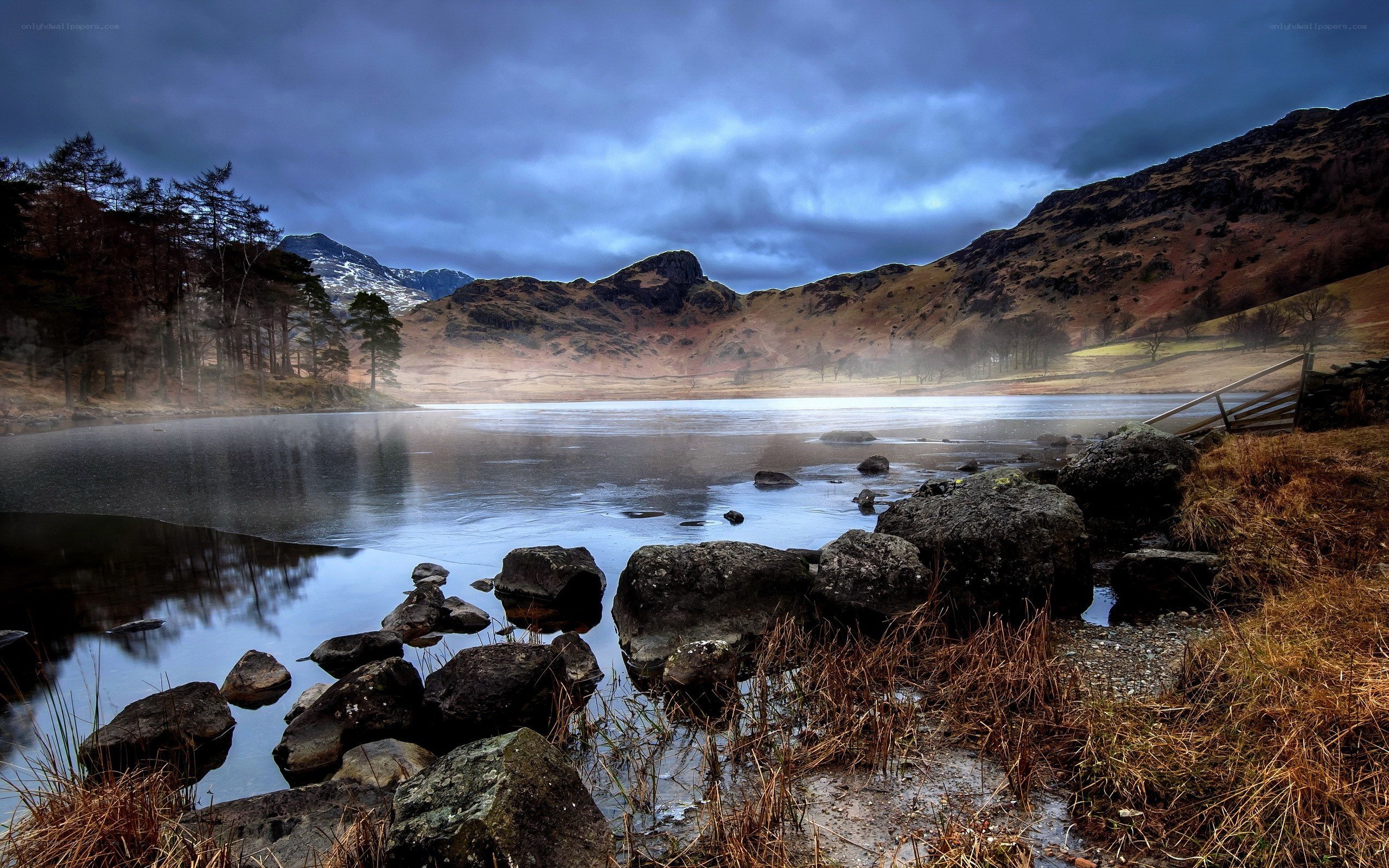 Lake with misty mountains