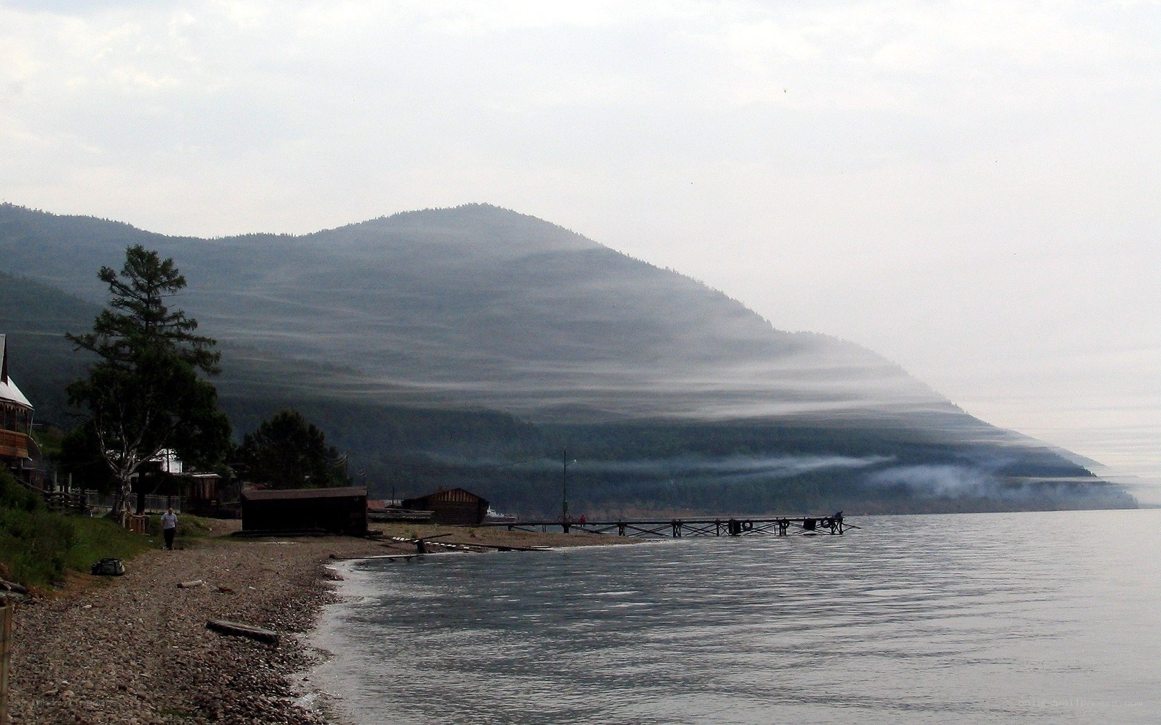Lake with misty mountains