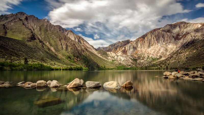 Lake with Mountain Backdrop — Blue, Serene, Afternoon, Photograph, Mountains, Rocks