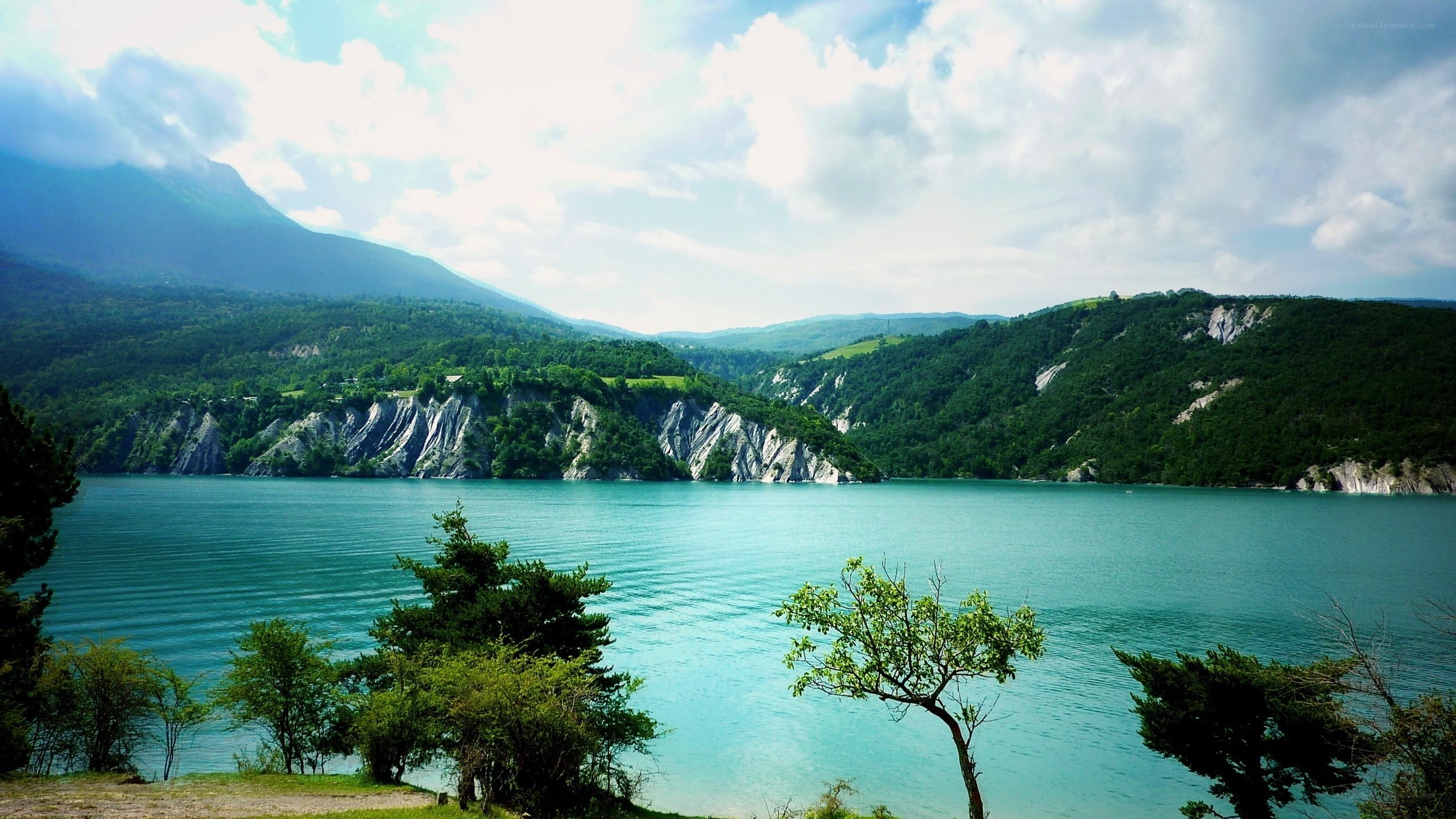 Lake with mountain cliffs
