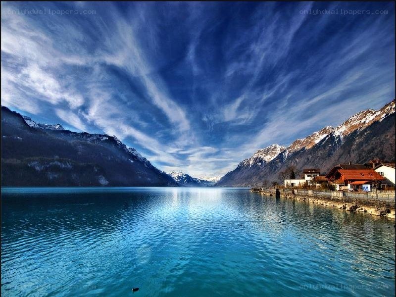 Lake with mountains and blue sky