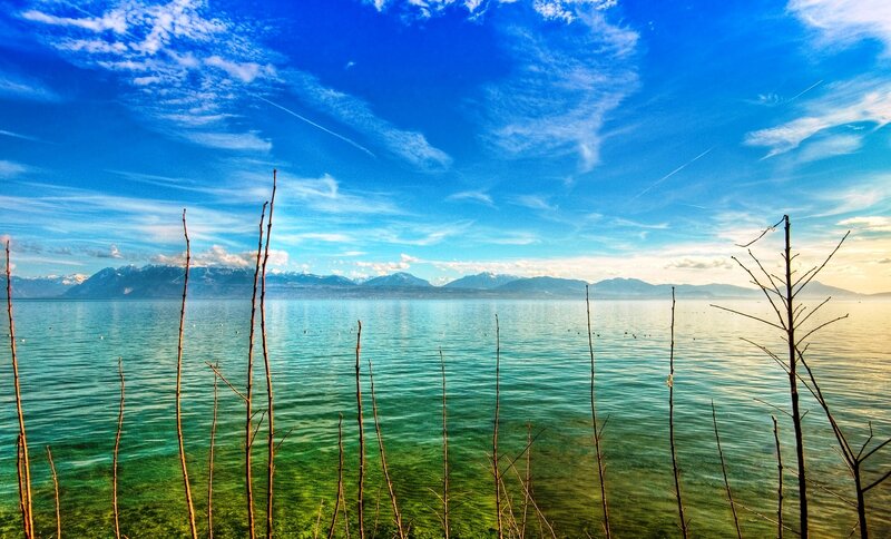 Lake with mountains and blue sky