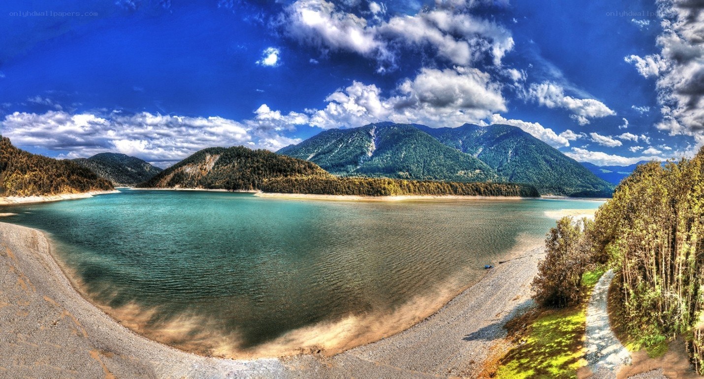 Lake with mountains and blue sky