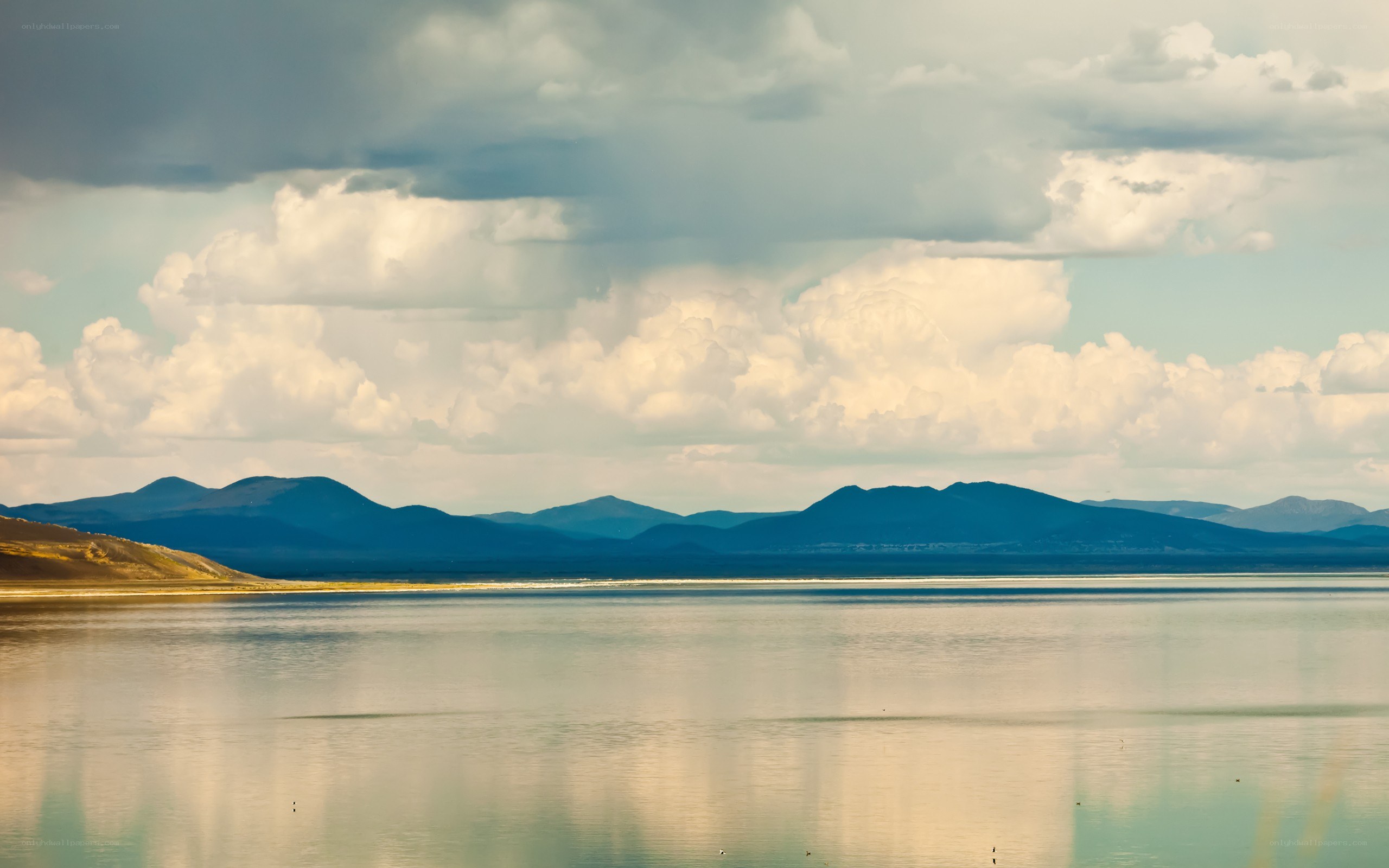 Lake with mountains and clouds