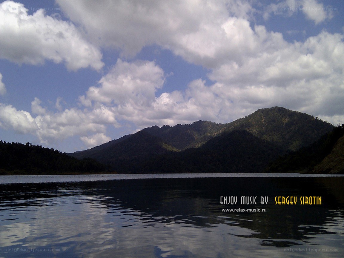 Lake with mountains and clouds
