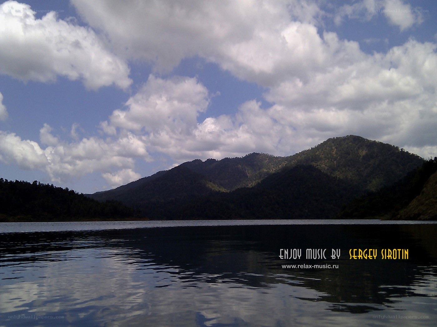 Lake with mountains and clouds