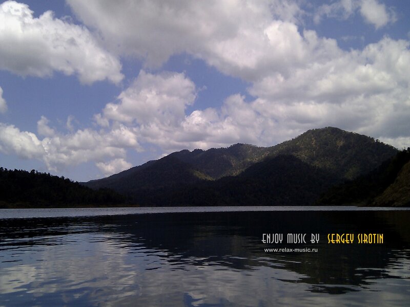 Lake with mountains and clouds