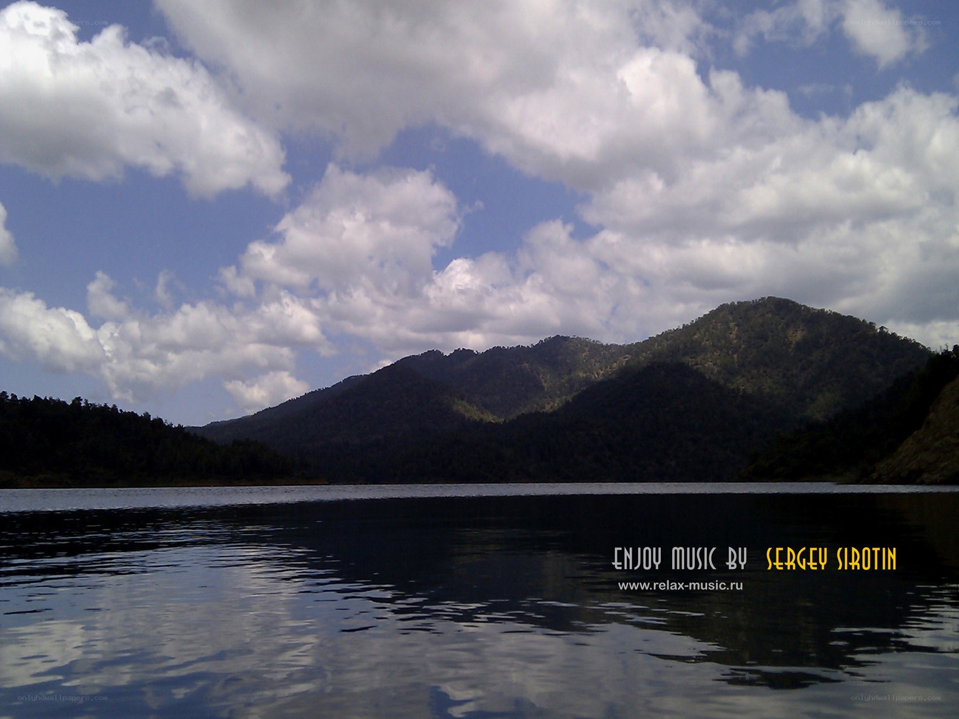 Lake with mountains and clouds