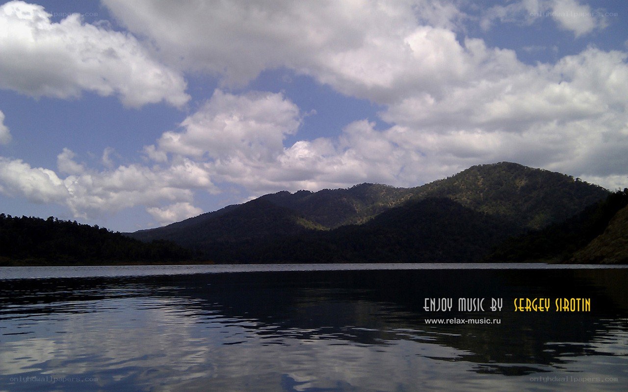 Lake with mountains and clouds