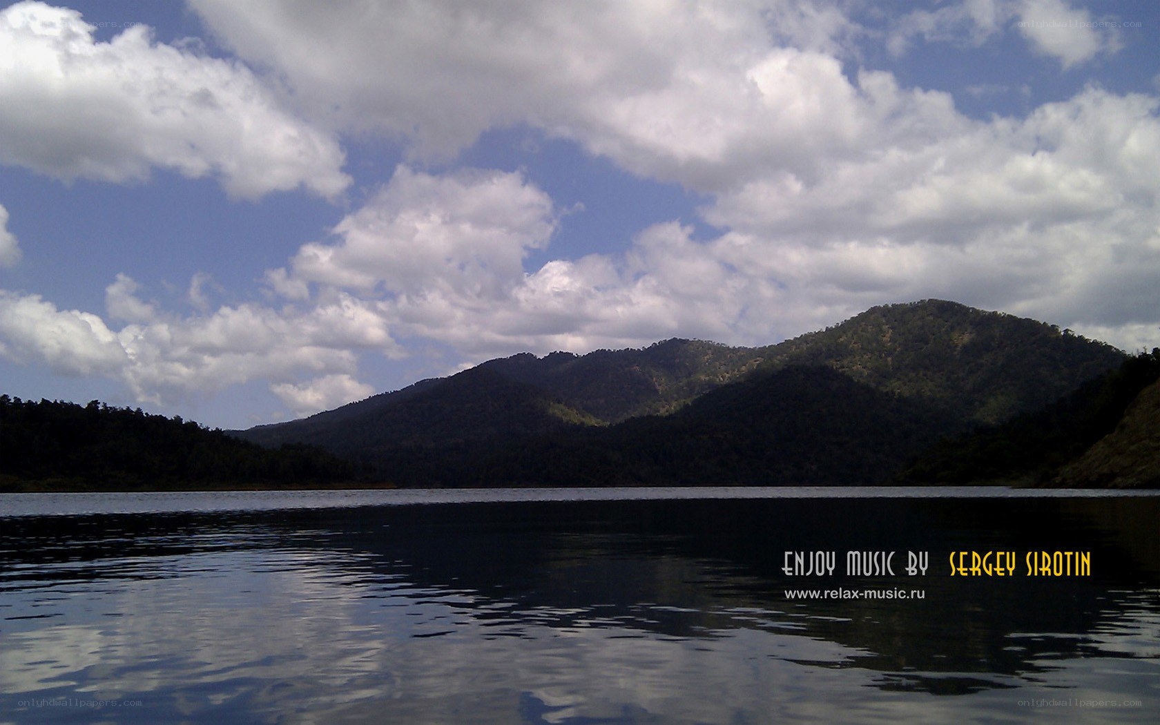 Lake with mountains and clouds