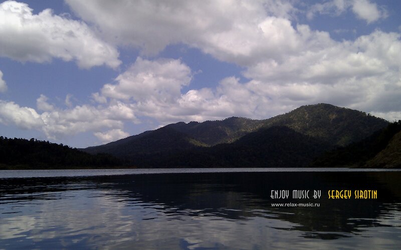 Lake with mountains and clouds