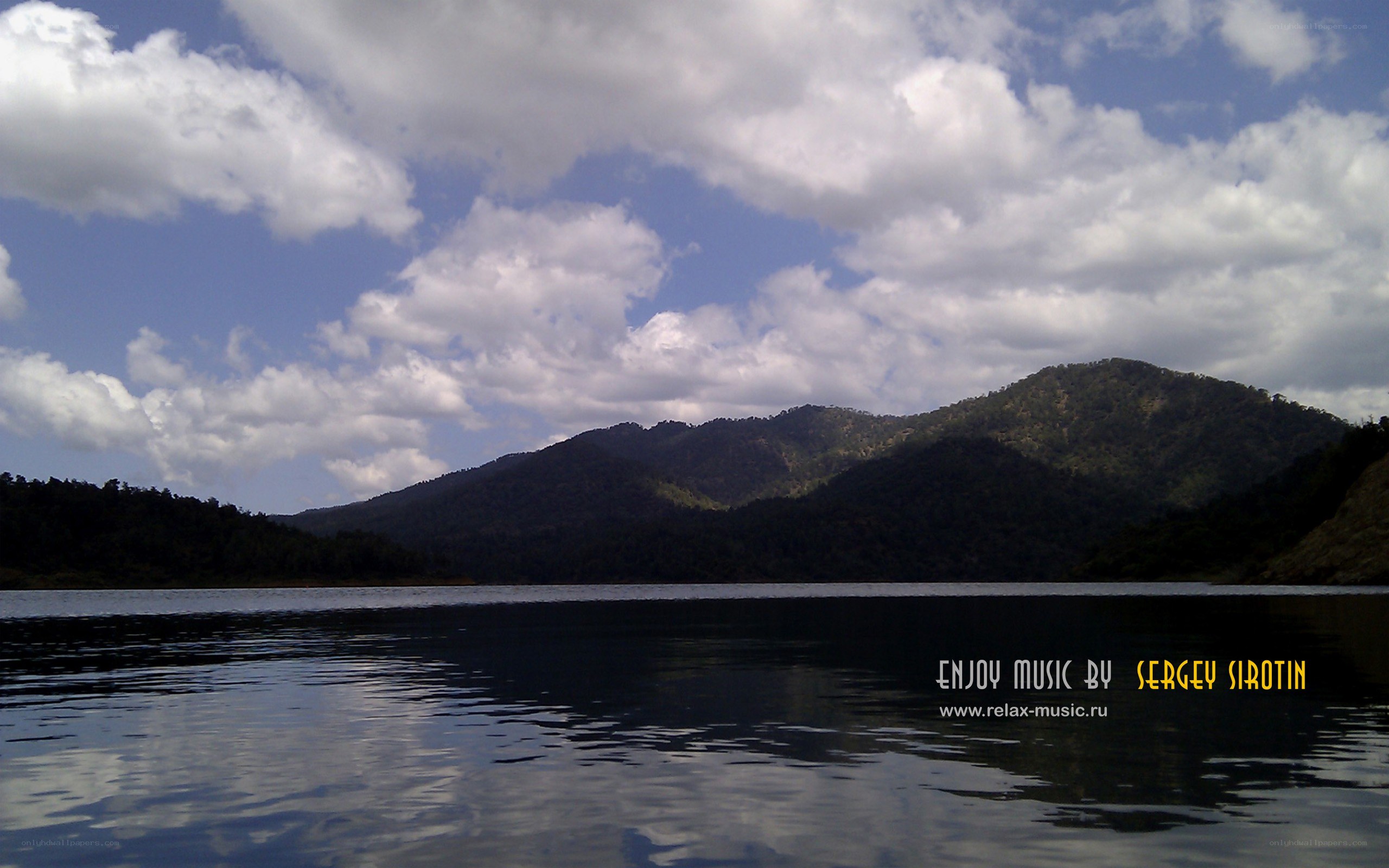 Lake with mountains and clouds