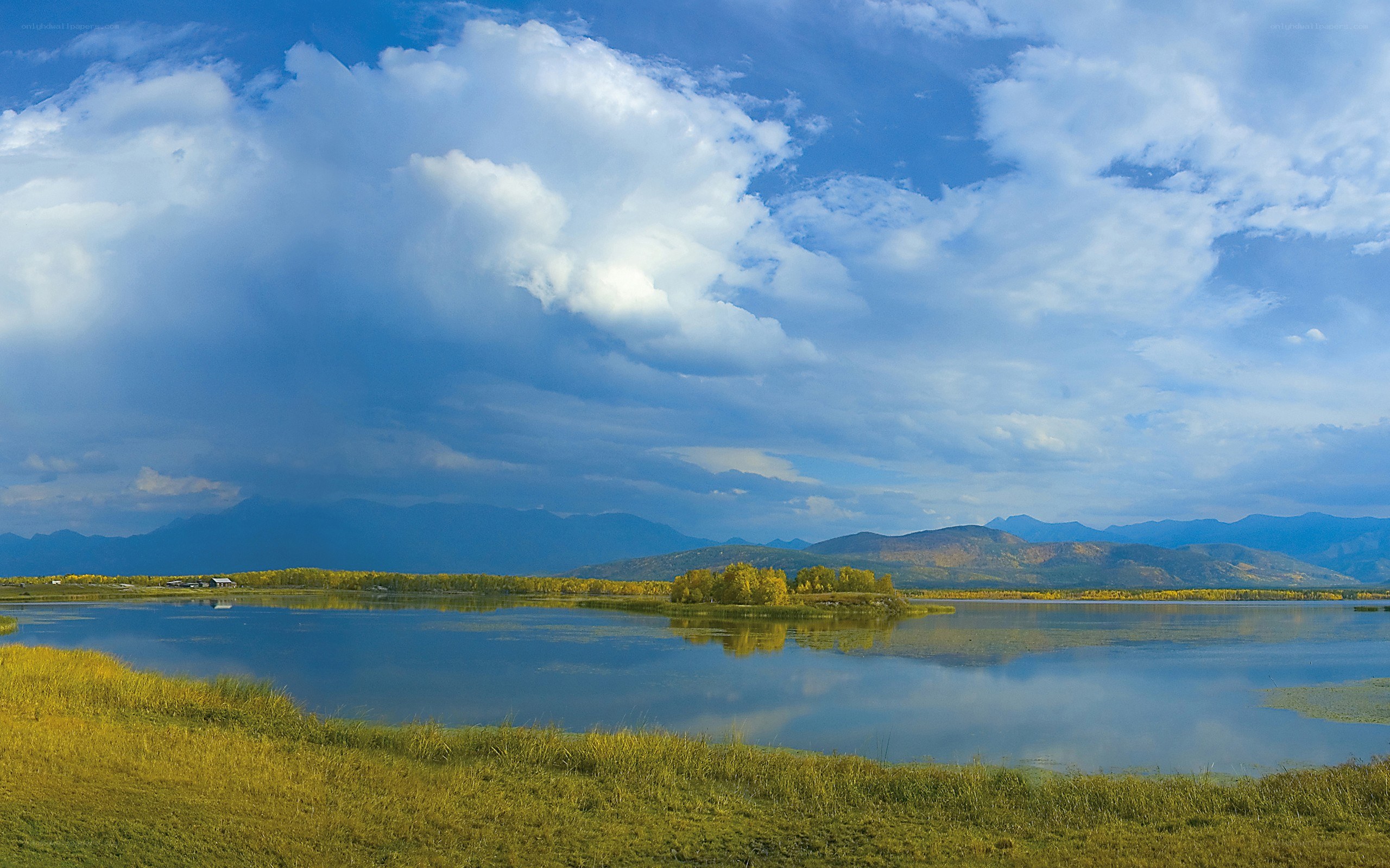 Lake with mountains and clouds