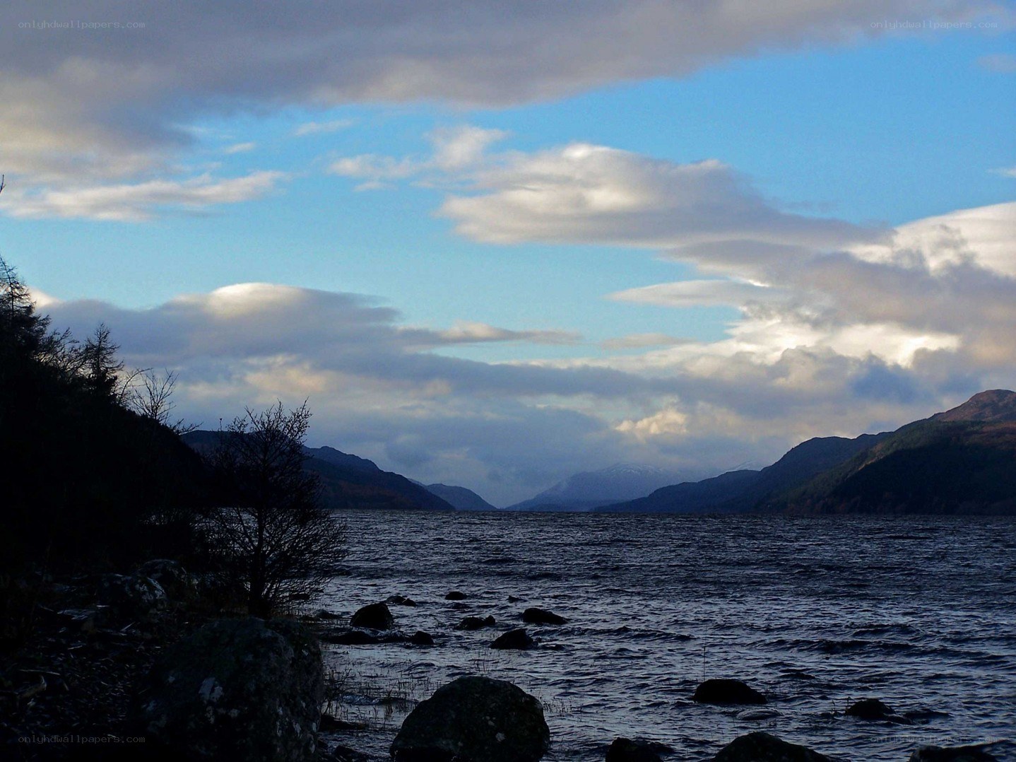 Lake with mountains and clouds