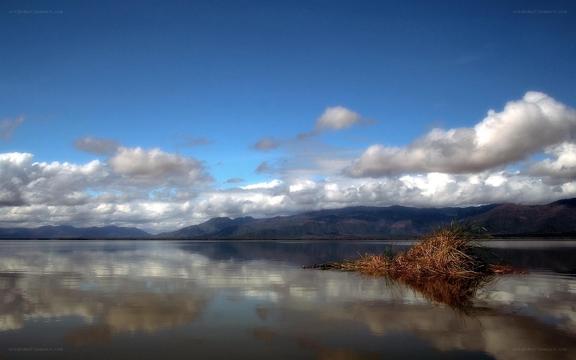 Lake with mountains and clouds
